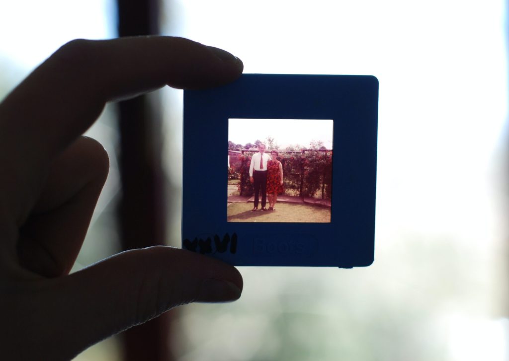 Old slide being held between fingers