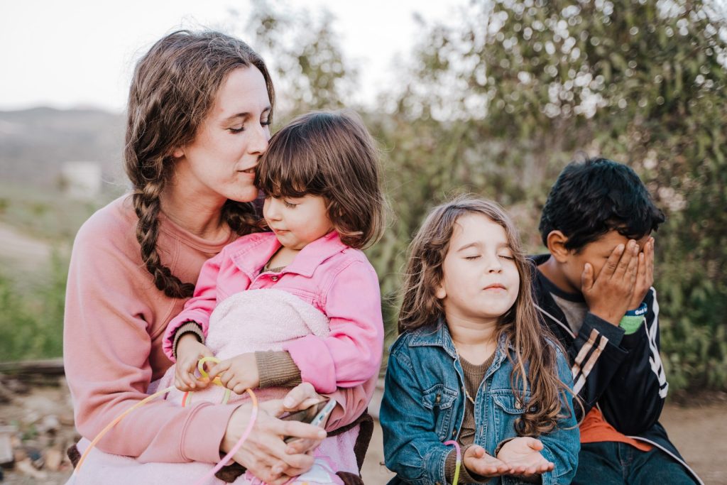 Woman sitting with children