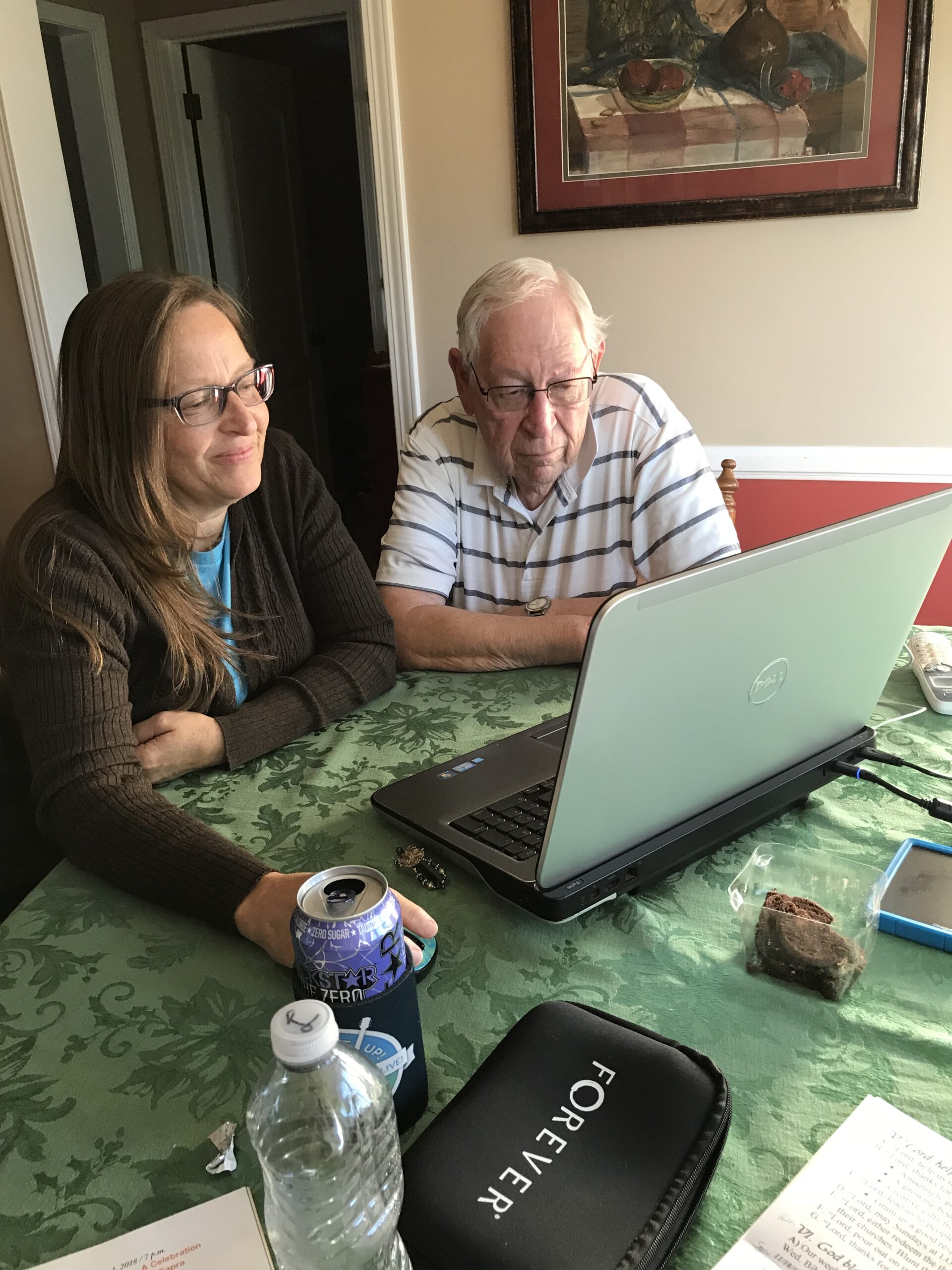 woman and man sitting at laptop
