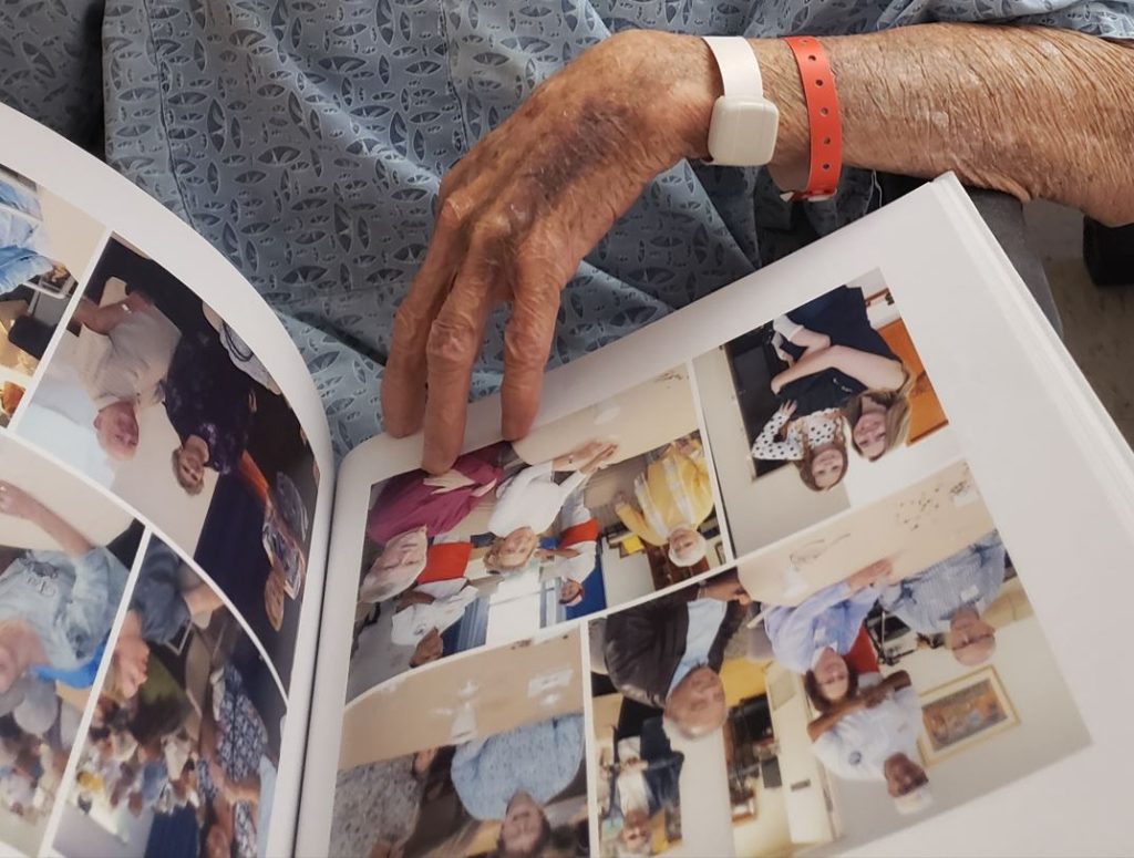 Man leafing through photo book