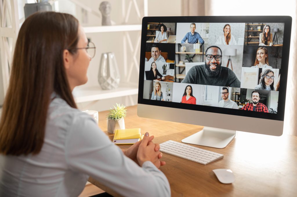 Woman looking at screen of online meeting