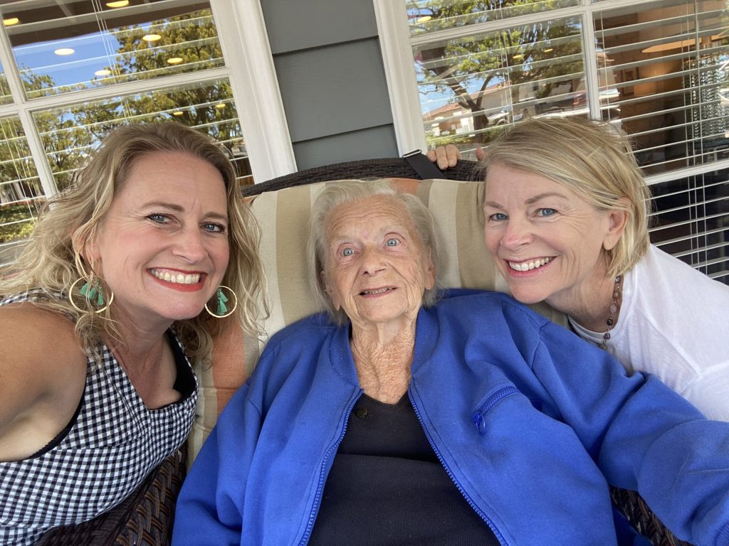 2 younger women with elderly woman