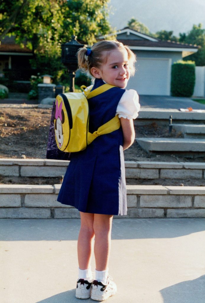 Kindergarten age girl with backpack