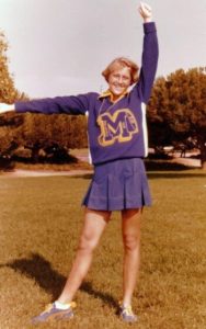Young woman in cheer outfit circa 1970s