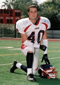 High school football player kneeling