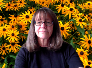 Woman's face with daisies in background