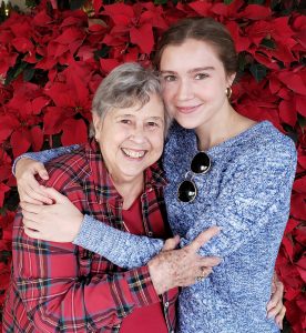 Young woman hugging older woman