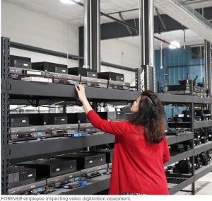 Woman looking at electronics rack