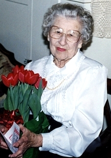 Older woman holding flowers