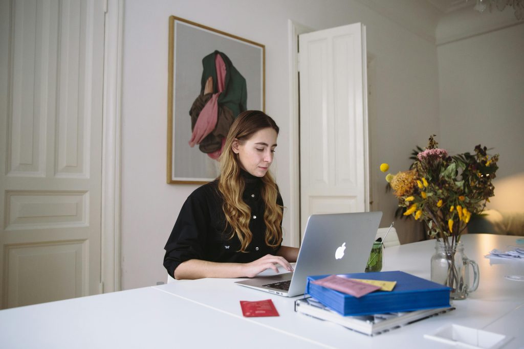 Woman at table on laptop