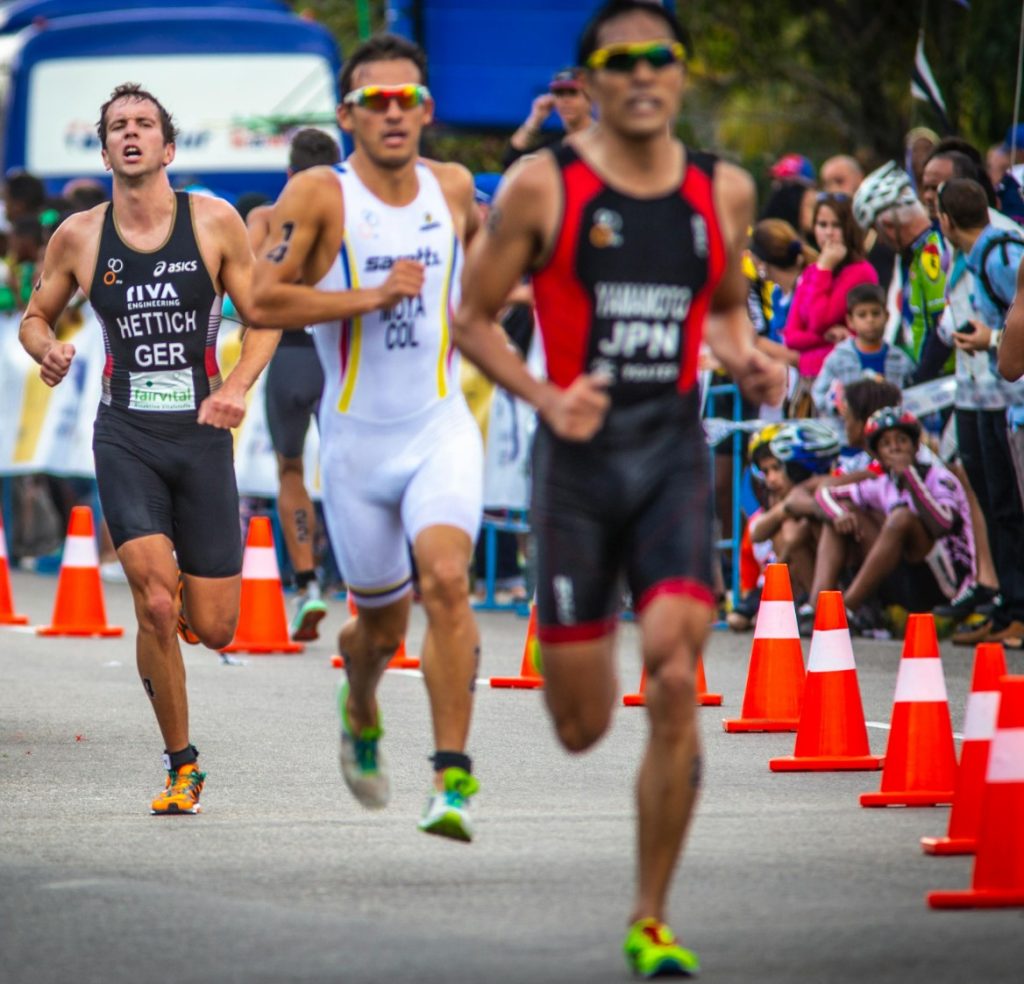 Runners rounding a curve on the street