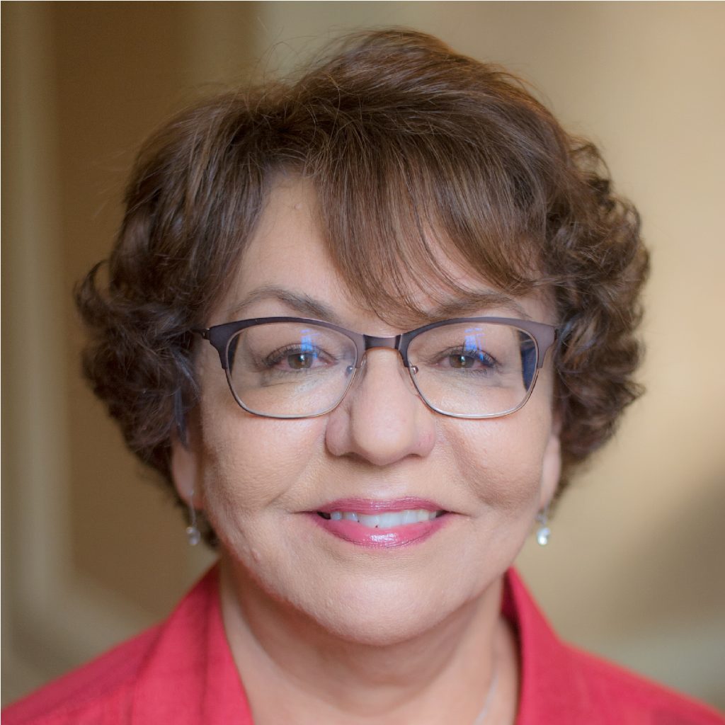 Woman wearing glasses looking at camera